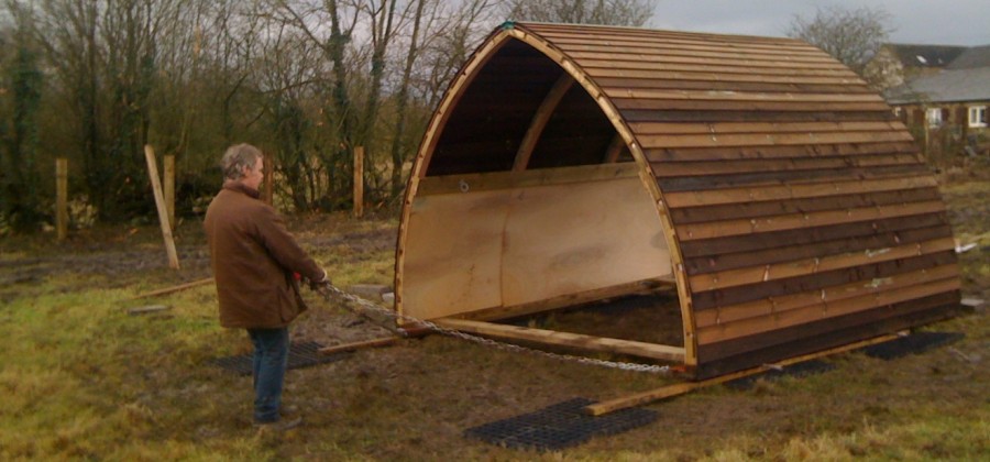 Field shelter being moved by hand